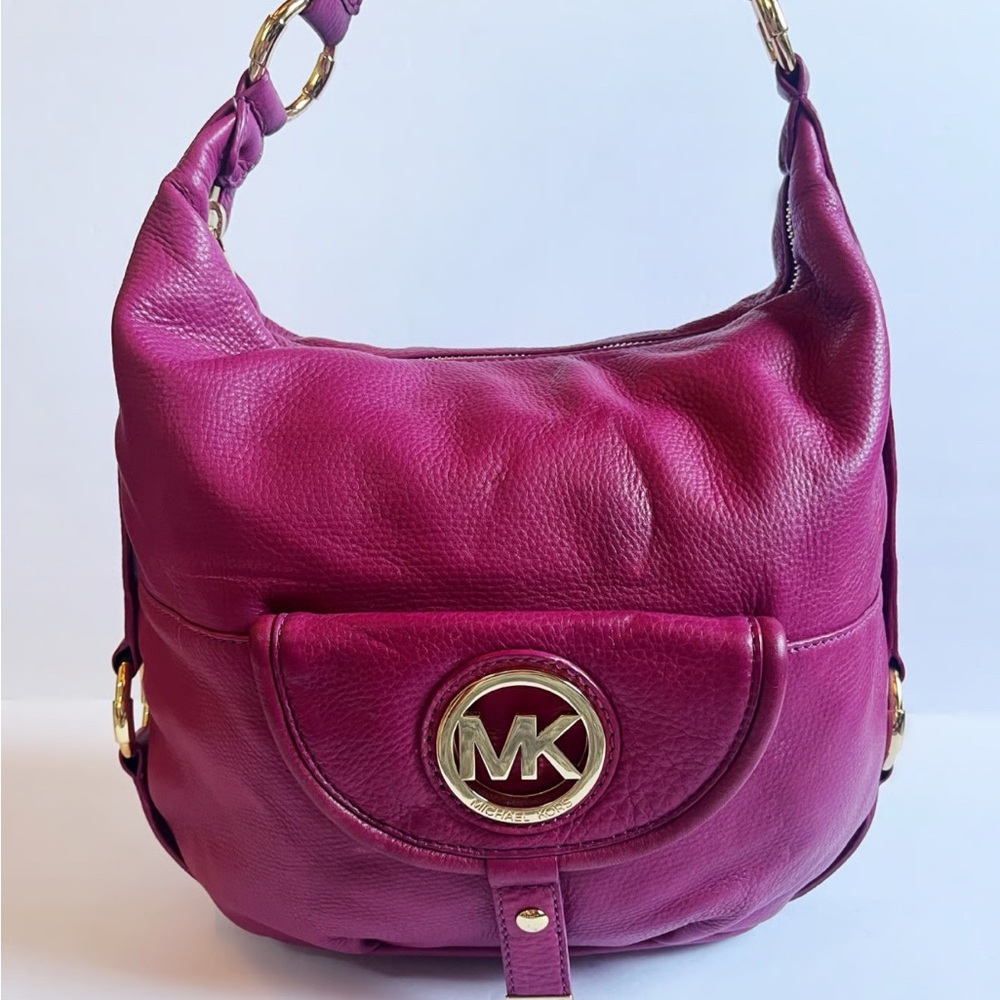 Michael Kors Pink Fulton hobo bag w/ pebbled leather & gold-tone hardware.